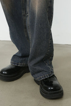 Faded wash baggy denim jeans in dark with a relaxed fit.