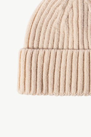 Chunky ribbed knit beanie in cream acrylic with a cuffed hem.