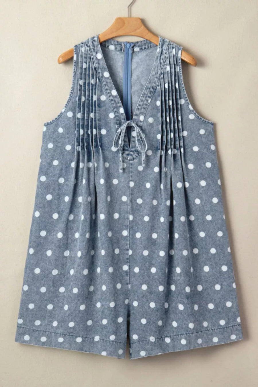 Denim polka dot tie-front romper with V-neck and pleats