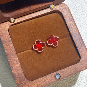earrings in red featuring clover shape and straight fit