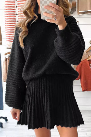 Black acrylic knit sweater set with balloon sleeves and pleated skirt