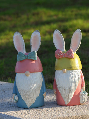 Easter bunny gnomes in pastel blue and blush pink, with white beards and bunny ears.