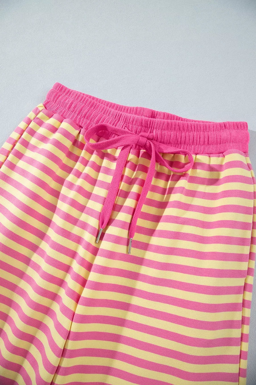 pale yellow pajama set featuring drawstring and striped