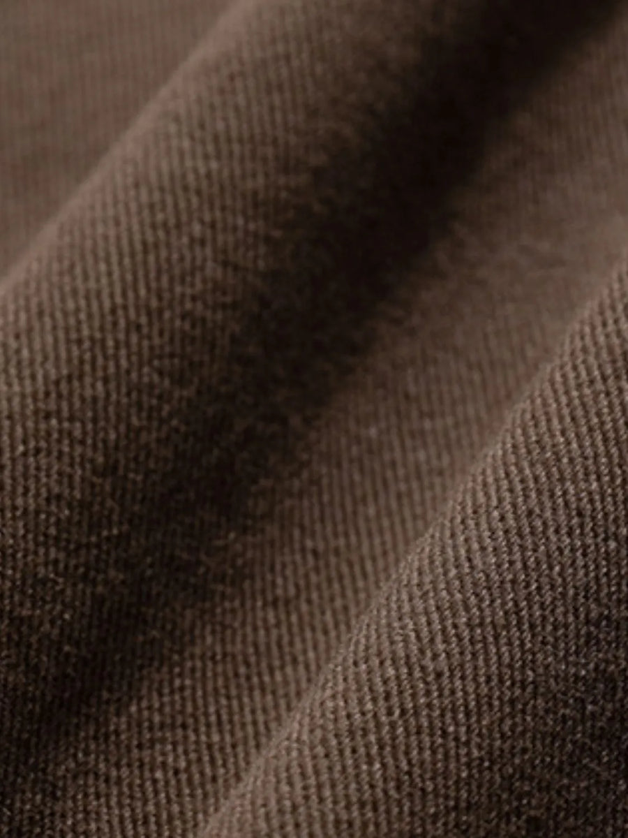 Wide-leg trousers in coffee brown fabric with visible texture and pleats.