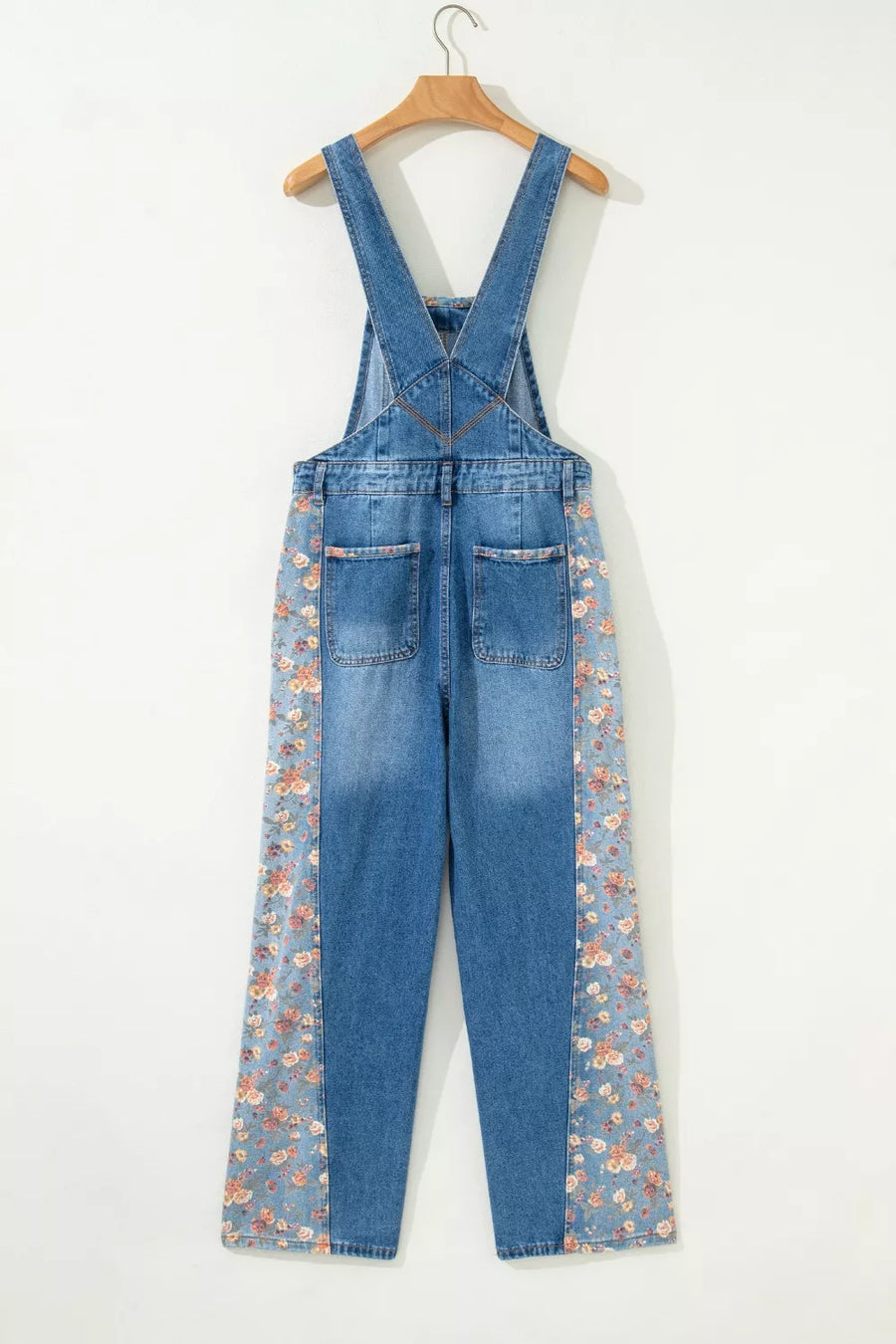 Denim overalls with vintage floral print side panels and back pockets.