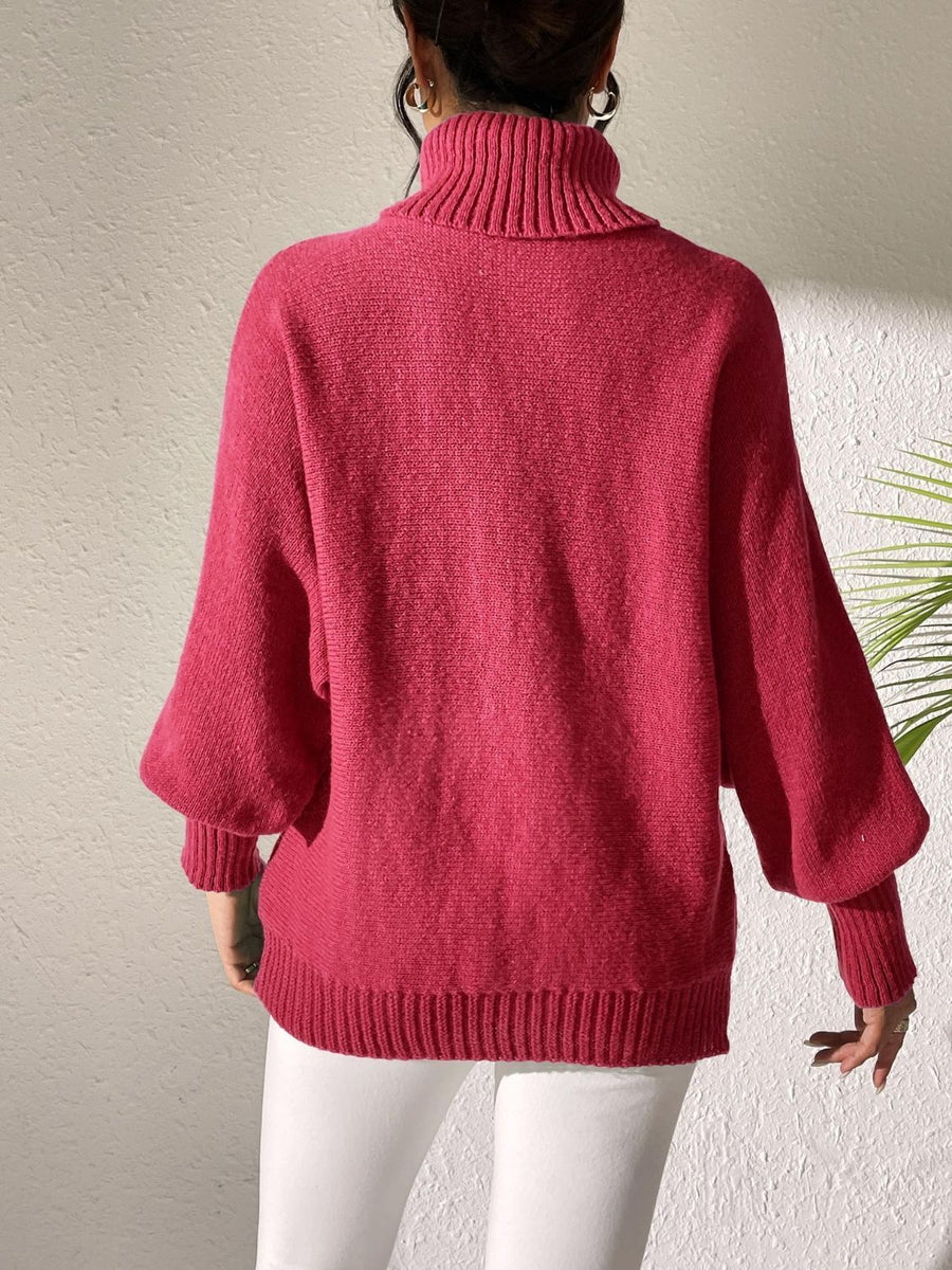 Deep Red knit sweater with turtleneck and dolman sleeves, featuring pearl embellishments.