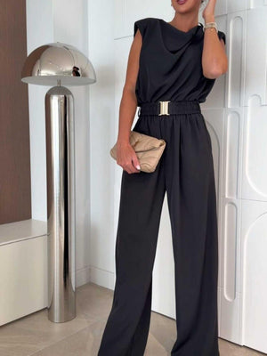 Black wide-leg jumpsuit with cowl neck, sleeveless design, and gold buckle belt.