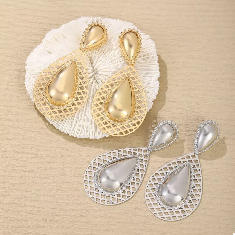 earrings in gold featuring hollowed-out and teardrop fit