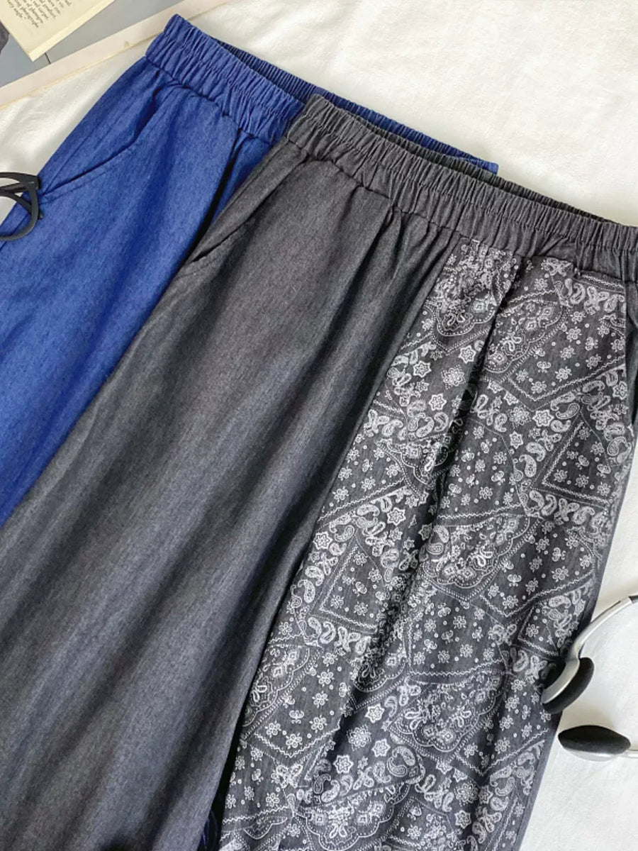 Printed comfort jeans in black and blue with drawstring waist and paisley pattern detail.