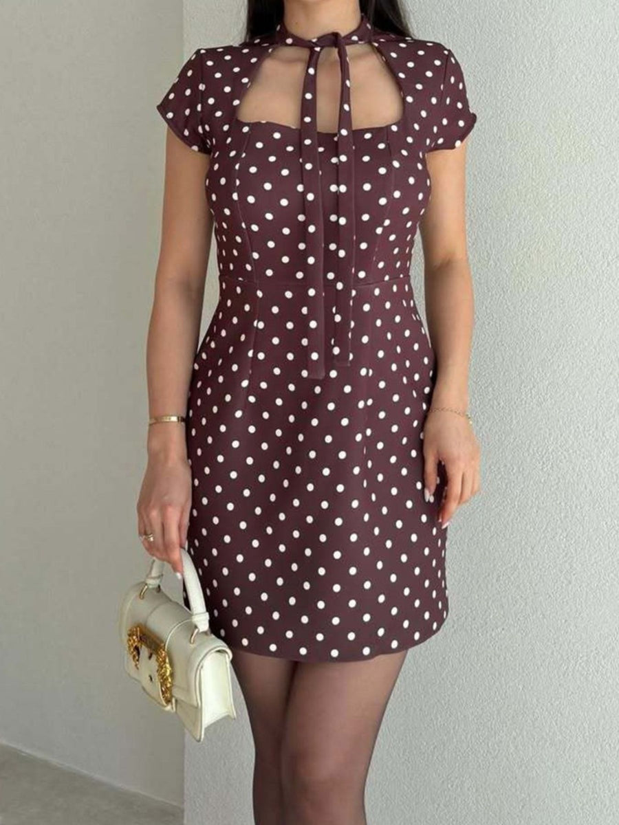 white mini dress featuring cutout and polka dot