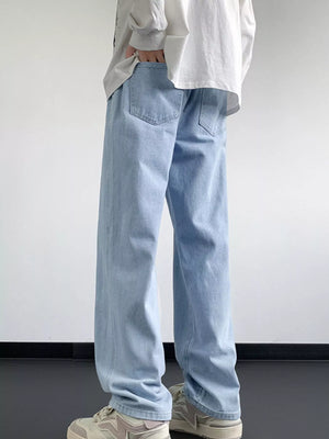 Light blue oversized drawstring jeans with a loose fit and classic back pockets.