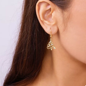 clear earrings featuring dangle and christmas-tree motif