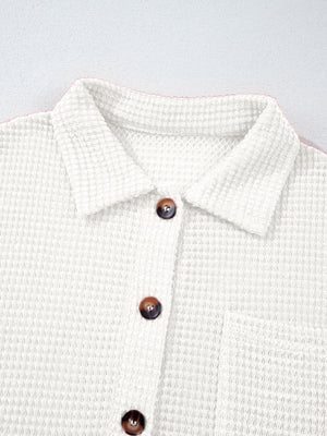 White waffle knit button-up shirt with chest pocket and brown buttons.
