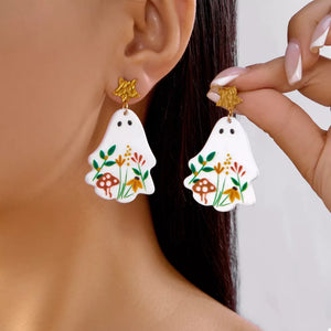 gold earrings featuring dangle and floral