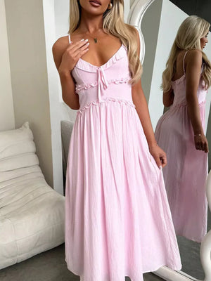 Pink ruffled midi dress with spaghetti straps and tie front, a-line cut