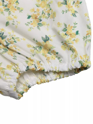 Charming floral mini dress with puff sleeves, white with yellow floral print and elasticated hem detail.