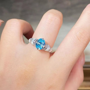 silver ring featuring zircon embellishment and geometric
