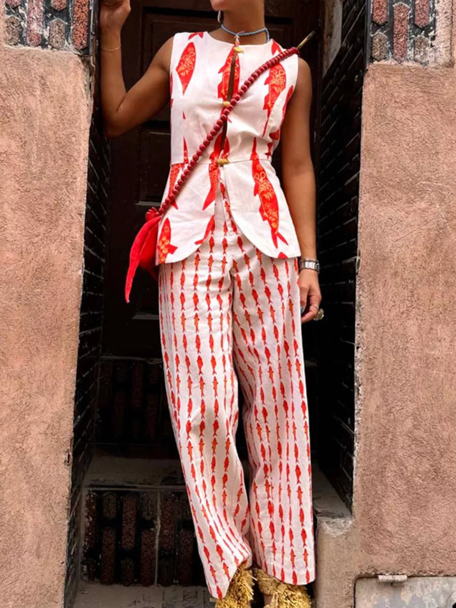 Red fish print sleeveless top and wide leg pants set with gold button details.