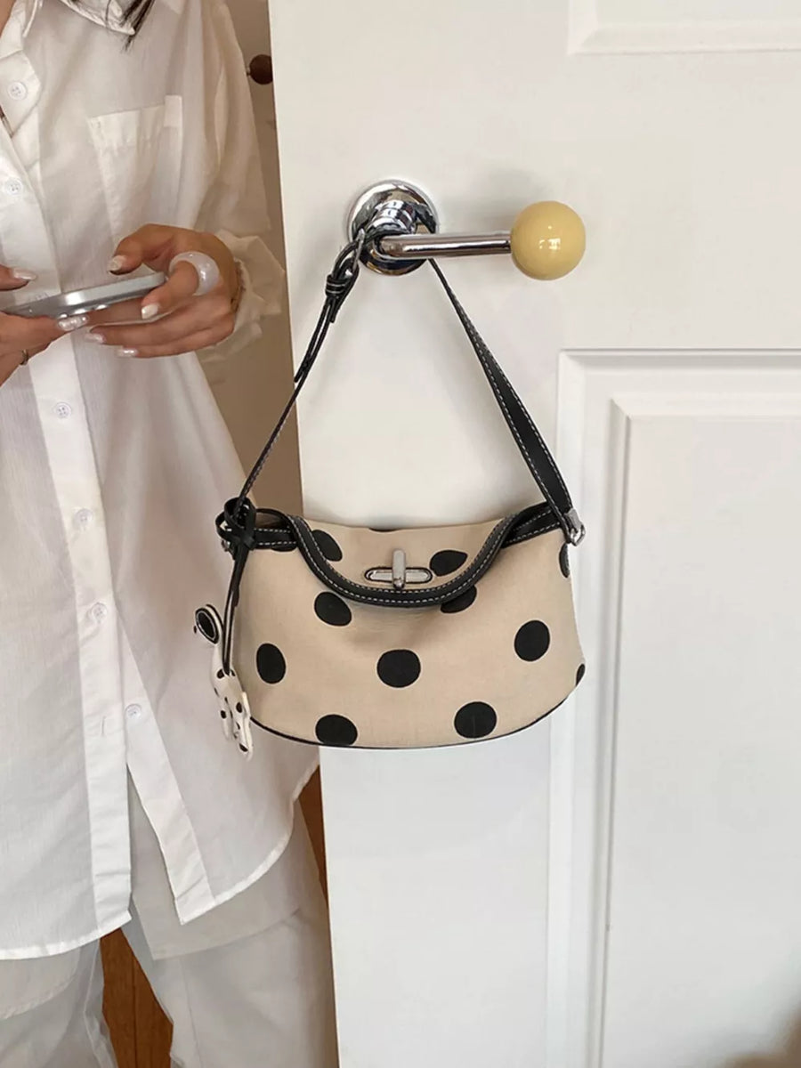 cream shoulder bag with turn-lock and polka-dot