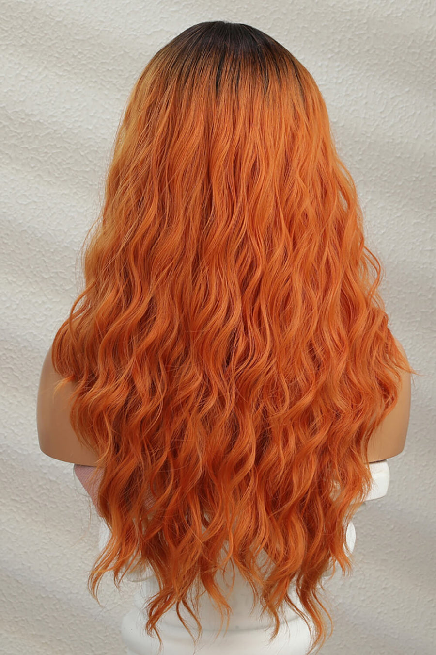 Sunset Ombre lace front wig with ginger/brunette root and wavy copper-orange hair.