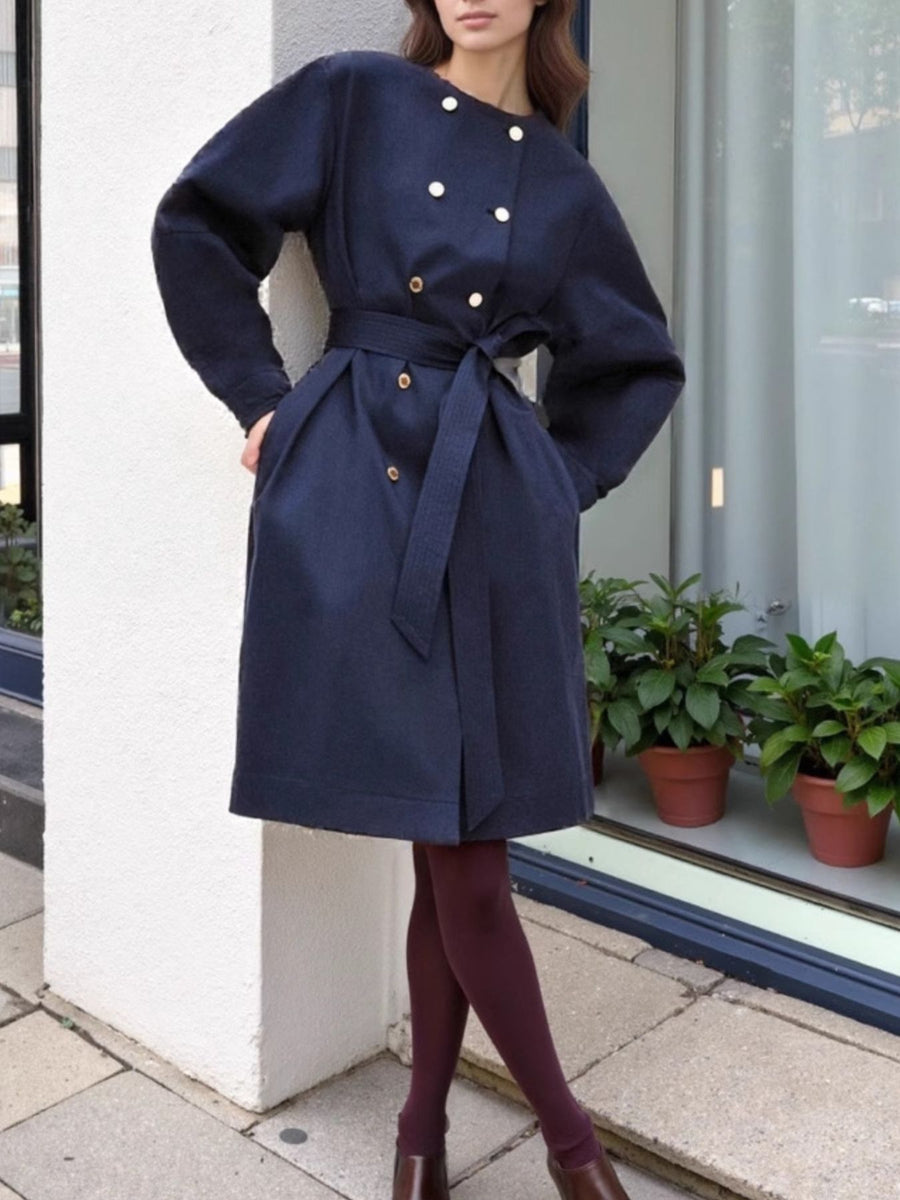 100% polyester Care instructions: Machine wash cold trench coat in Navy Blue with A-line silhouette