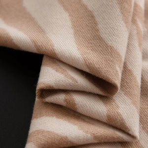 Zebra stripe wool scarf in khaki with fringed edges.