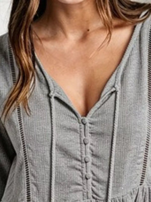 100% polyester Care instructions: Machine wash cold peplum top in Gray with peplum silhouette