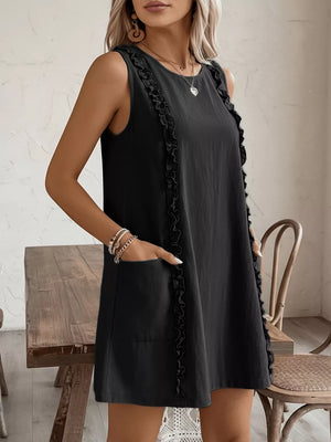 Black sleeveless dress with frill details and pockets.