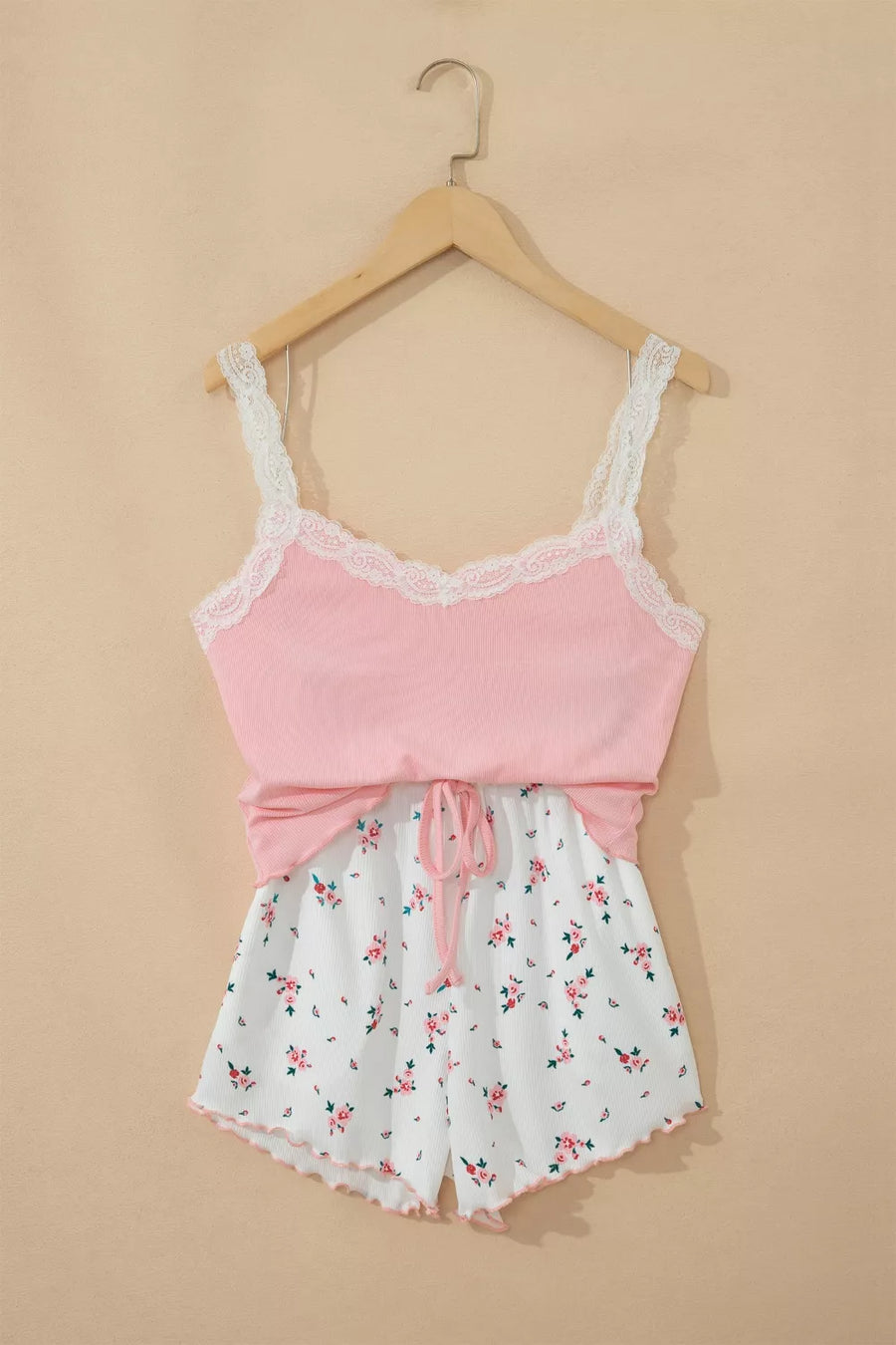 Pink lace-trimmed cami pajama set with white floral print drawstring shorts
