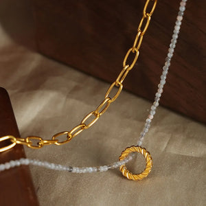 Gold layered chain and beaded necklace with twisted ring pendant