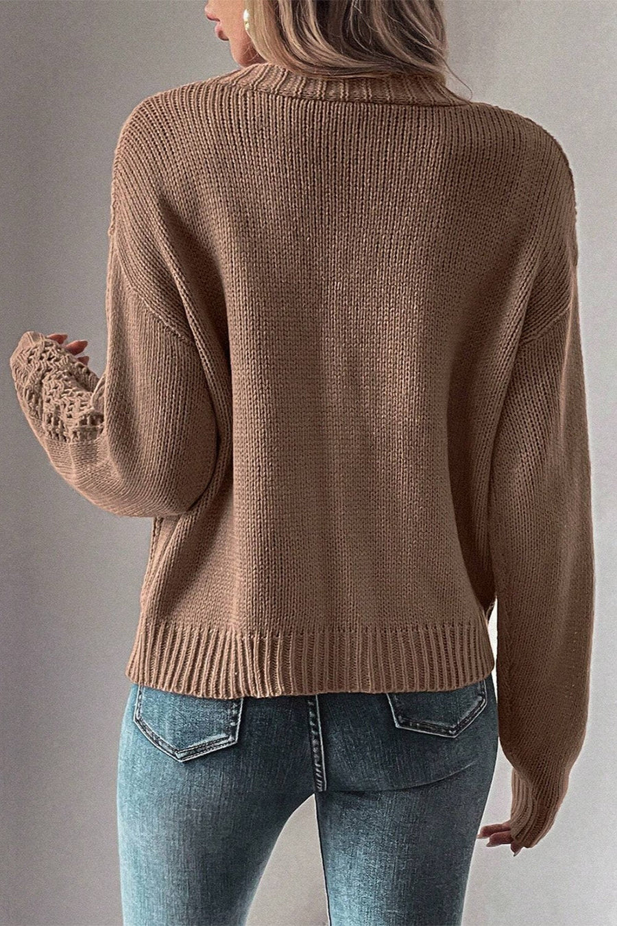 Taupe knit cardigan with mesh detail on sleeves and ribbed cuffs.