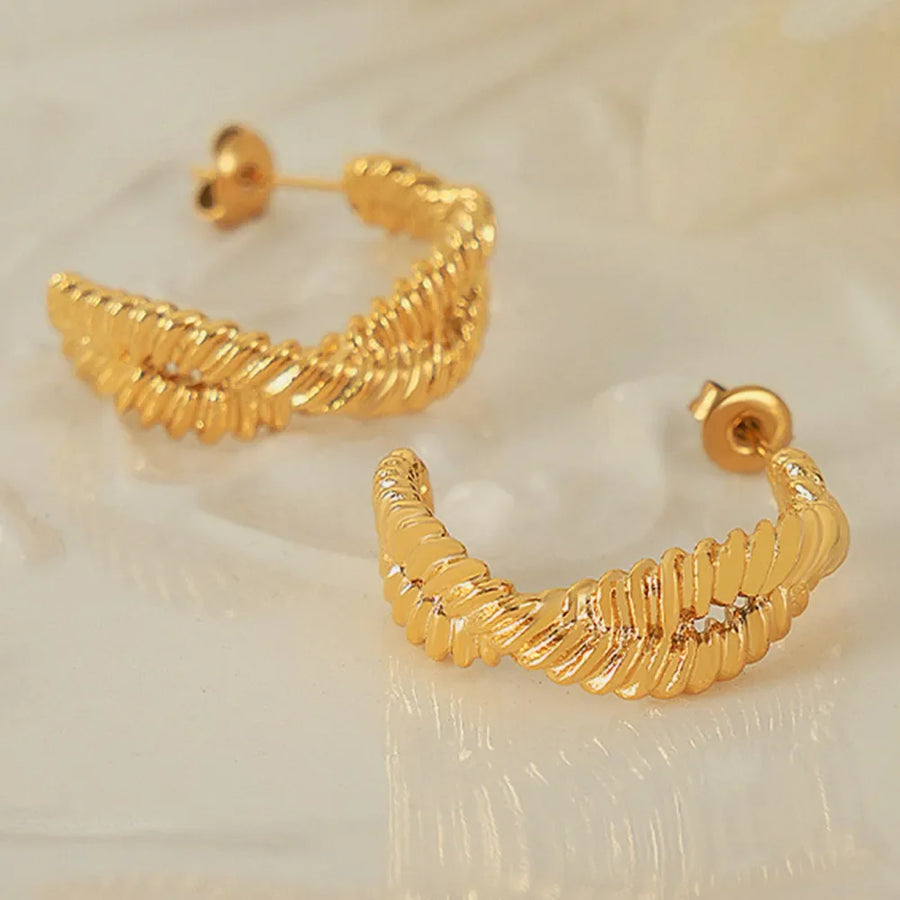Gold vermeil braided hoop stud earrings with a textured design.