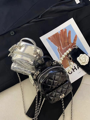 backpack in silver featuring quilted and boxy fit