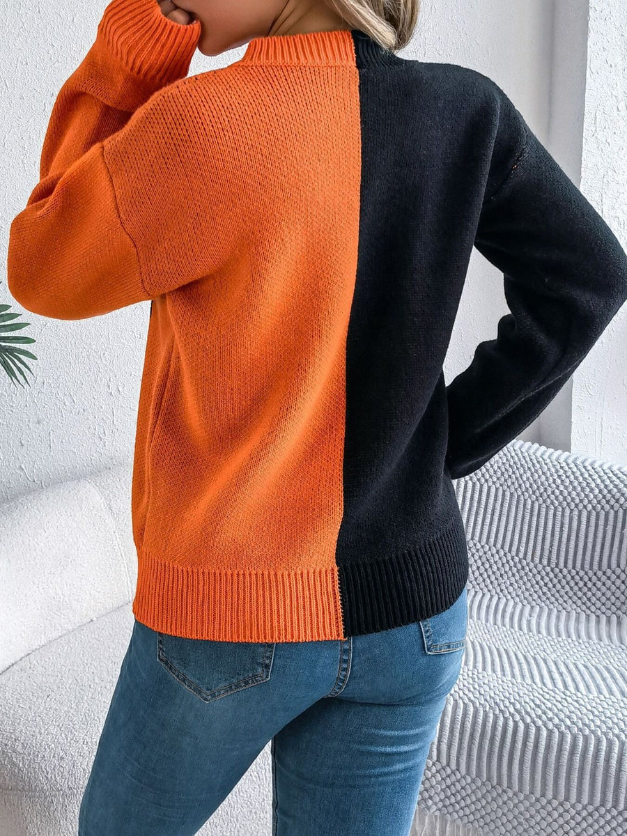 pullover sweater in orange with graphic and stretch