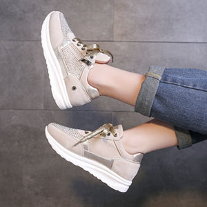 Khaki lace-up sneakers with rhinestone embellishments and a chunky sole.