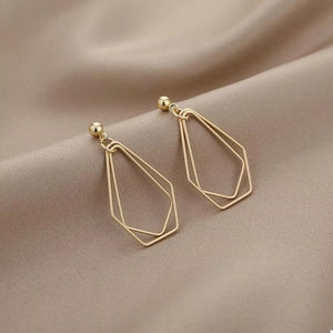 gold earrings with geometric and null