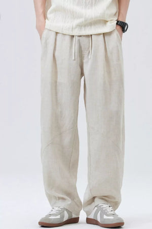 Loose fit drawstring casual pants in apricot with a relaxed cut and subtle seam details.