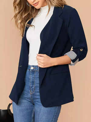 Navy blue blazer with roll-up striped sleeves and a single button closure.