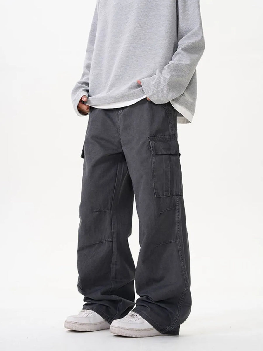 Grey cargo pants with versatile pockets and a relaxed fit.