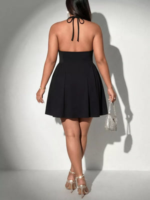 Black halter A-line dress with lace trim and a tie back.