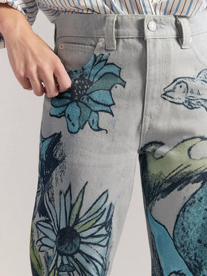 White wide-leg jeans with zip-front, button-front and mixed-motif print