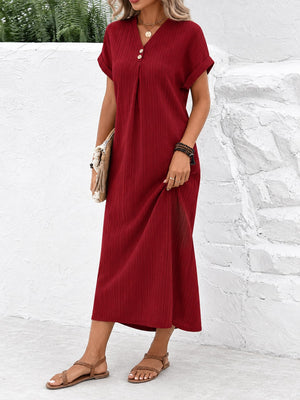 sage green midi dress featuring decorative button and ribbed