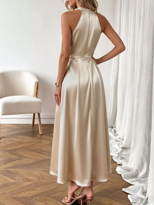 Elegant pearl-embellished satin midi dress in champagne, a-line cut, halter neck.