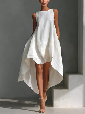 White asymmetrical sleeveless flowing dress with a high-low hemline.