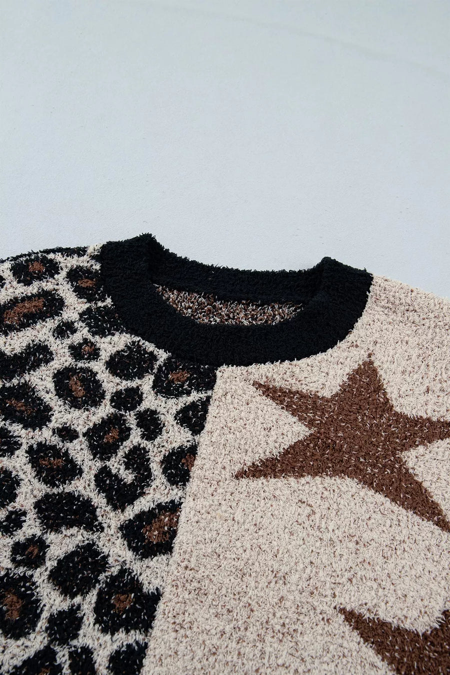 black pullover sweater with pullover and leopard-print, animal-print, star