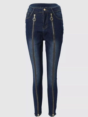 Dark blue skinny jeans with full-length front zippers and ring pulls.