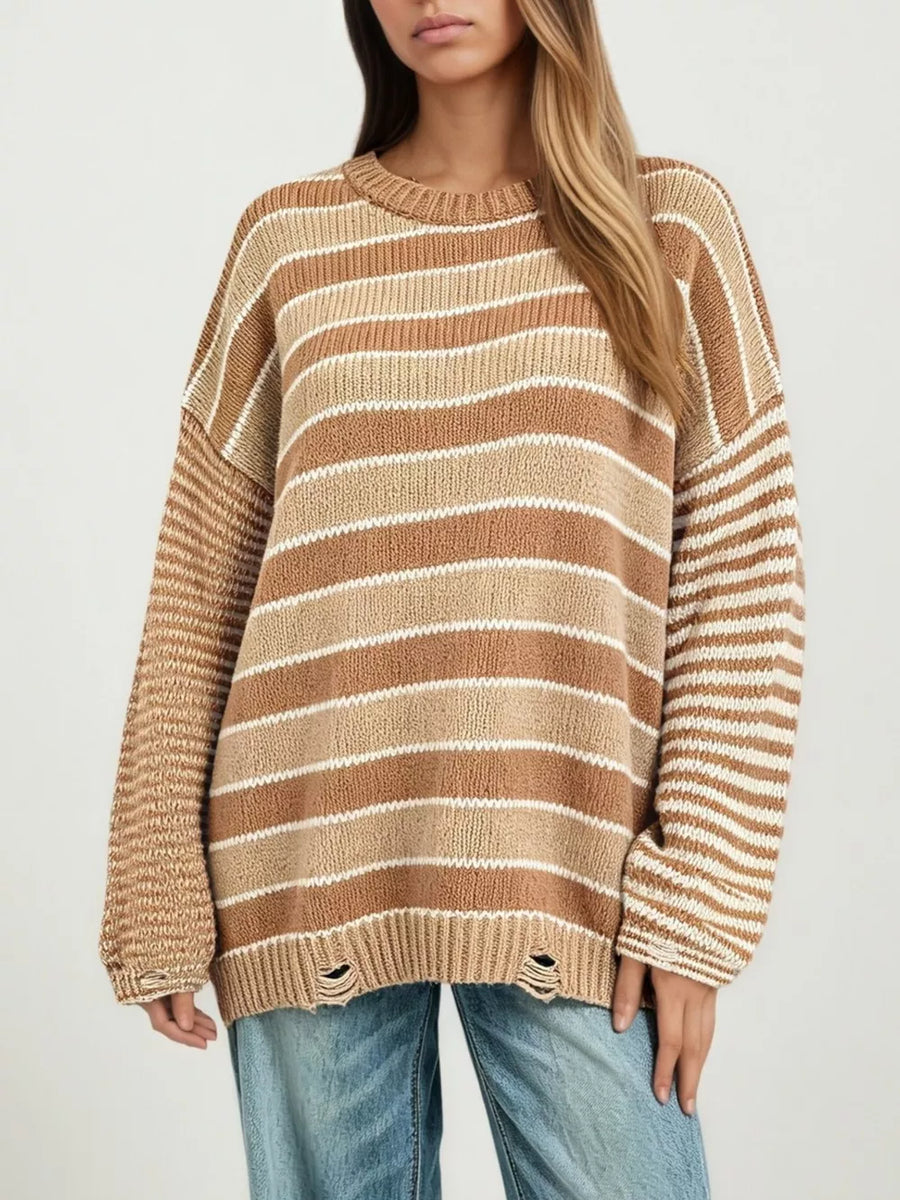 100% polyester Care instructions: Machine wash cold pullover sweater in ivory with oversized silhouette