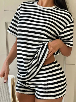 Waffle knit striped two-piece loungewear set in black and white with crew neck top and shorts.