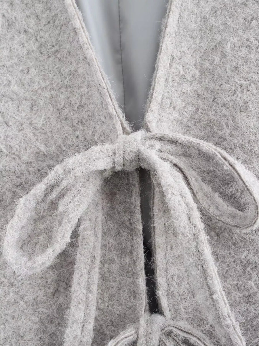 Silver gray textured knit tie-front cardigan with a fuzzy finish and tie detail.
