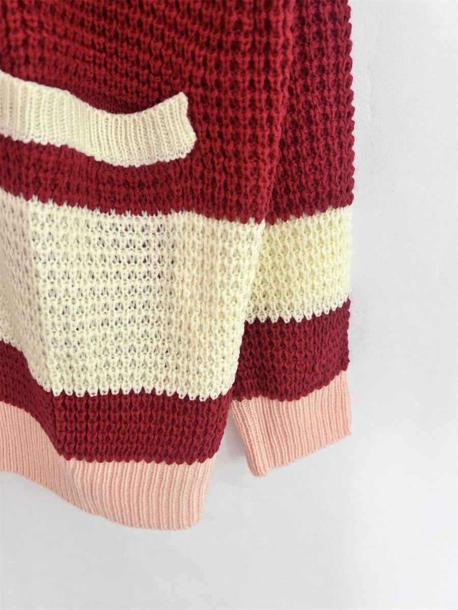 Striped knit sweater with a pocket in red, cream, and pink